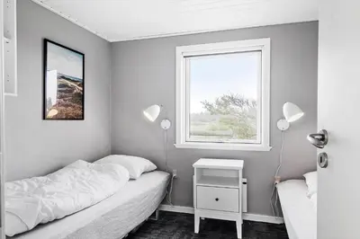 a small bedroom with a bed and a window at 149-Snedsted-Lykkens-Hab-39 in Snedsted