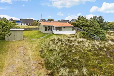 a house sitting on top of a grass field at 131-Thisted-Aerenprisvej-13 in Thisted