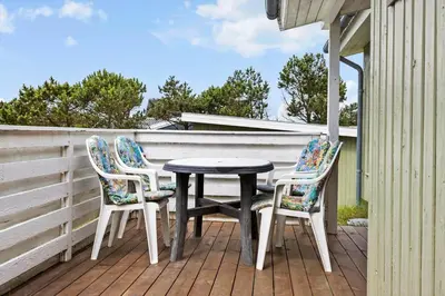 a table and two chairs on a porch at 131-Thisted-Aerenprisvej-13 in Thisted