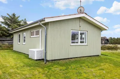 a green building with a window on a yard at 131-Thisted-Aerenprisvej-13 in Thisted