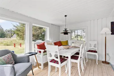 a white dining room with a white table and chairs at 630-Thisted-Kristinesvej-40 in Thisted