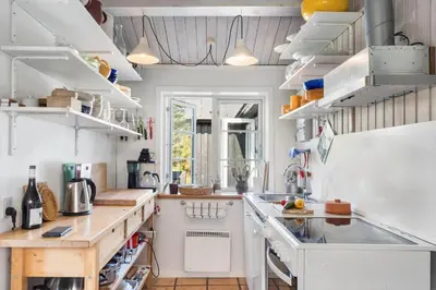 a kitchen with white cabinets and a counter top at 255-Thisted-Kraen-Knudsens-Vej-13 in Thisted