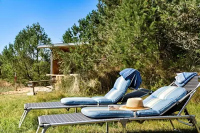 two lounge chairs and a table with a hat on them at 255-Thisted-Kraen-Knudsens-Vej-13 in Thisted