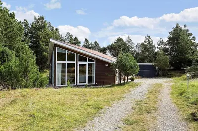 a small house on a hill next to a road at 704-Thisted-Kristinesvej-54 in Thisted