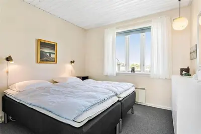a bedroom with a large bed with a window at 615-Thisted-Julius-Poulsens-Vej-7 in Thisted