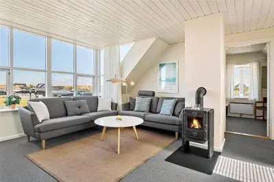 a living room with a couch and a stove at 615-Thisted-Julius-Poulsens-Vej-7 in Thisted