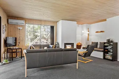 a living room with a couch and a tv at 406-Vestervig-Bekkasinvej-6 in Vestervig