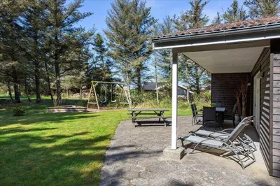 a patio with a picnic table and a playground at 406-Vestervig-Bekkasinvej-6 in Vestervig