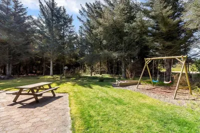 a park with a picnic table and a swing at 406-Vestervig-Bekkasinvej-6 in Vestervig