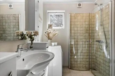 a bathroom with a shower and a sink and a shower at 406-Vestervig-Bekkasinvej-6 in Vestervig