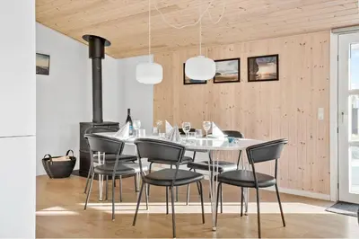 a dining room with a white table and chairs at 475-Thisted-Muslingevej-5 in Thisted