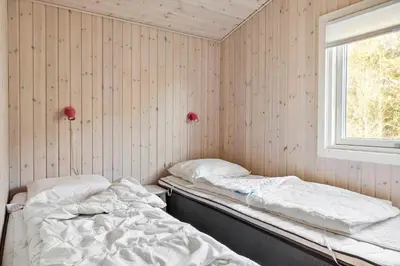 a room with two beds and a window at 475-Thisted-Muslingevej-5 in Thisted