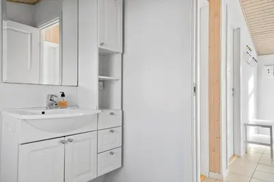 a white bathroom with a sink and a mirror at 475-Thisted-Muslingevej-5 in Thisted