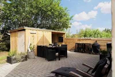 a patio with a table and chairs and a piano at 492-Thisted-Tunvej-7-B in Thisted