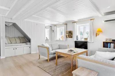 a living room with a couch and a table at 492-Thisted-Tunvej-7-B in Thisted