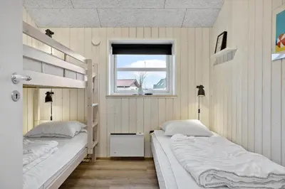 a bedroom with two bunk beds and a window at 898-Thisted-Nordsovej-46-B in Thisted