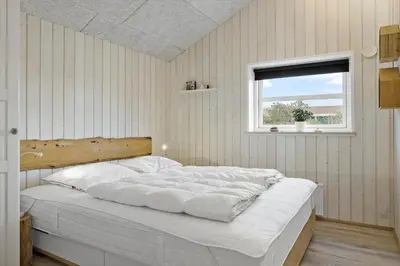 a bedroom with a large white bed with a window at 898-Thisted-Nordsovej-46-B in Thisted