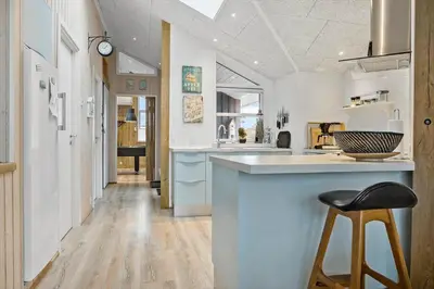 a kitchen with a counter and a bar with a stool at 898-Thisted-Nordsovej-46-B in Thisted