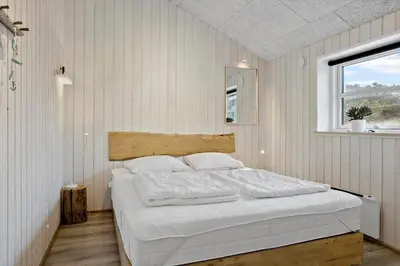 a bedroom with a large white bed with a window at 898-Thisted-Nordsovej-46-B in Thisted