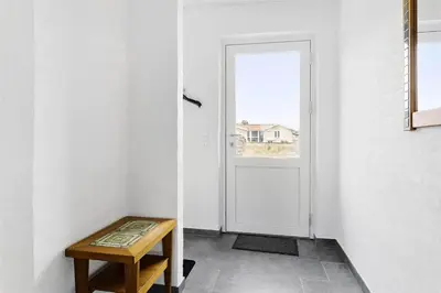 a room with a door and a table and a window at 803-Thisted-Hummervej-3 in Thisted