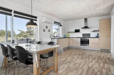 a kitchen and dining room with a table and chairs at 803-Thisted-Hummervej-3 in Thisted