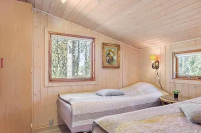 a bedroom with two beds and two windows at 257-Thisted-Blamunkevej-34 in Thisted