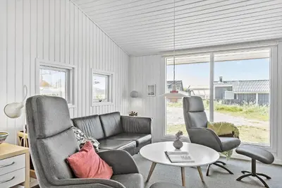 a living room with a couch and two chairs and a table at 160-Thisted-Bredkaervej-33 in Thisted