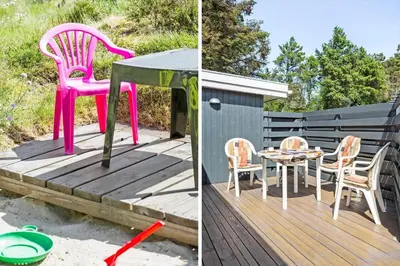 a pink chair and a table and chairs on a deck at 160-Thisted-Bredkaervej-33 in Thisted