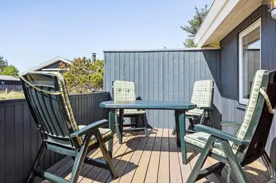 a table and chairs sitting on a deck at 160-Thisted-Bredkaervej-33 in Thisted