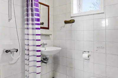 a bathroom with a sink and a toilet and a shower at 541-Thisted-Nordsovej-49 in Thisted