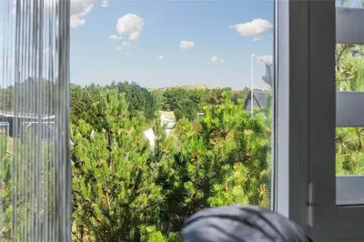 a window with a view of a forest of trees at 541-Thisted-Nordsovej-49 in Thisted
