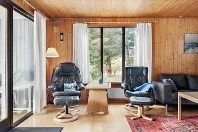 a living room with two chairs and a table at 337-Thisted-Hummervej-11 in Thisted