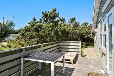 a bench sitting on a deck next to a house at 410-Thisted-Julius-Poulsens-Vej-13 in Thisted