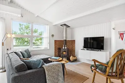a living room with a couch and a fireplace at 410-Thisted-Julius-Poulsens-Vej-13 in Thisted