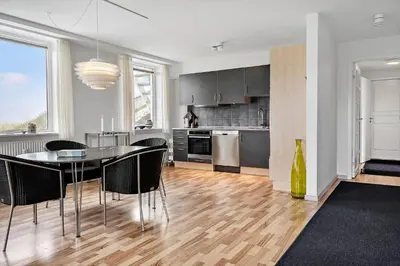 a kitchen with a table and chairs in a room at 303-Thisted-Hotelvej-5-F in Thisted