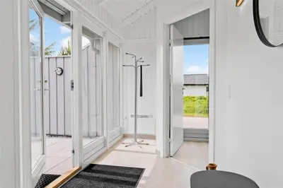 a hallway with white walls and large windows at 620-Thisted-Pighvarvej-20 in Thisted
