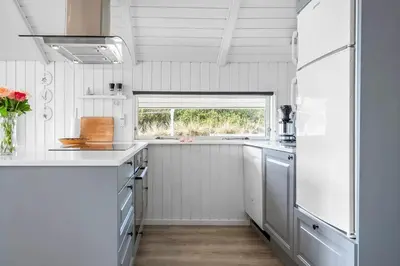 a white kitchen with a window and a sink at 620-Thisted-Pighvarvej-20 in Thisted