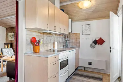 a small kitchen with a sink and a stove at 711-Thisted-Blamunkevej-24 in Thisted