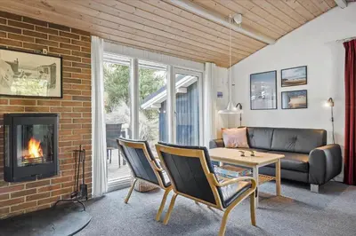 a living room with a couch and a fireplace at 711-Thisted-Blamunkevej-24 in Thisted