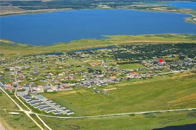 an aerial view of a parking lot next to a body of water at 110-Vestervig-Svanholmvej-10 in Vestervig