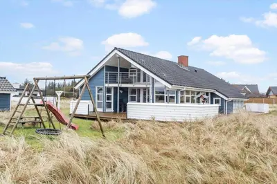 a house with a playground in front of it at 362-Thisted-Ostersvej-1 in Thisted