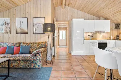 a living room with a couch and a kitchen at 466-Thisted-Muslingevej-6 in Thisted