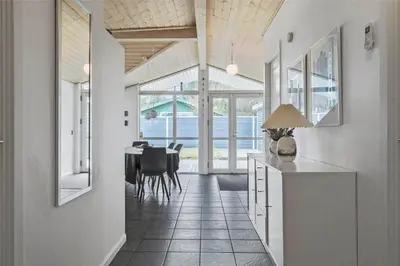 a kitchen and dining room with a table and chairs at 433-Thisted-Tunvej-20 in Thisted
