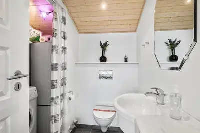 a white bathroom with a sink and a toilet at 433-Thisted-Tunvej-20 in Thisted