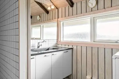 a kitchen with a sink and two windows at 915-Thisted-P-Bolesens-Vej-11 in Torsted