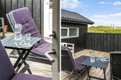 a patio with a table and chairs on a deck at 915-Thisted-P-Bolesens-Vej-11 in Torsted