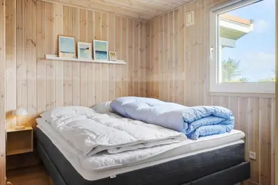 a bed in a room with a window at 211-Vestervig-Rylevej-1 in Vestervig