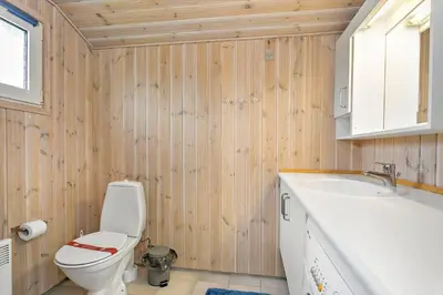 a bathroom with a toilet and a sink at 211-Vestervig-Rylevej-1 in Vestervig