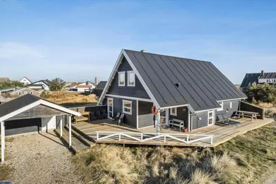 a home with a large deck and a house at 718-Thisted-Orredvej-36 in Thisted