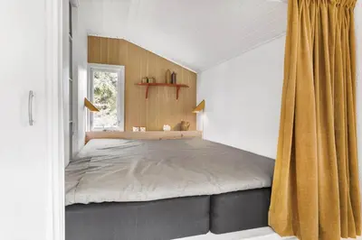 a bedroom with a large bed with a window at 114-Thisted-Tunvej-14 in Thisted